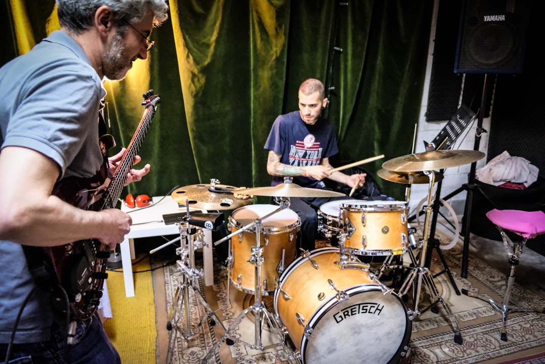 man-in-blue-t-shirt-playing-drum-set-vd94edo8zvm