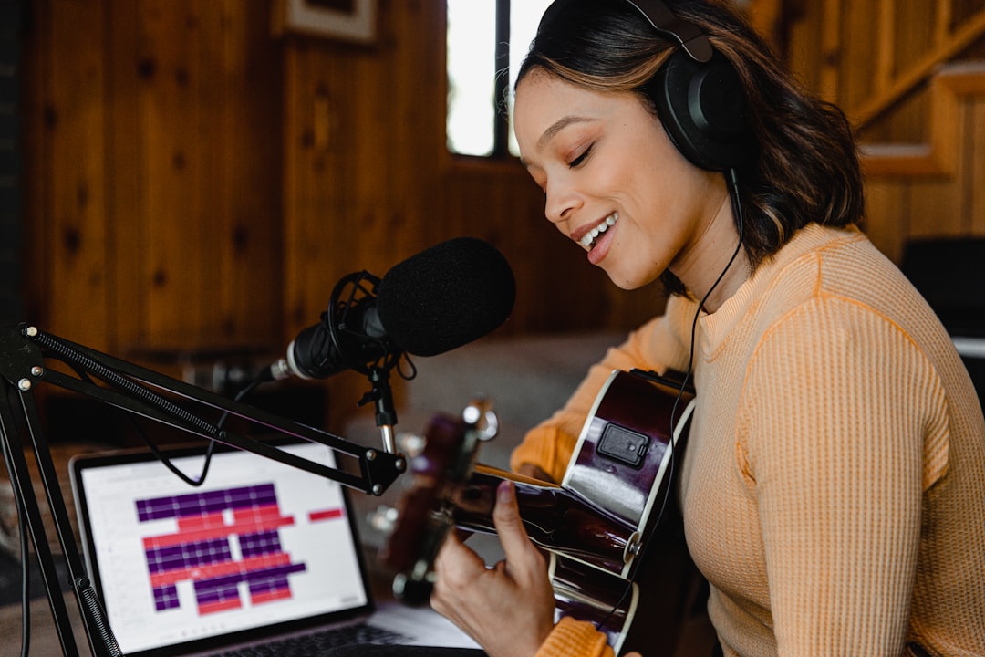 woman-in-brown-sweater-wearing-headphones-d0sxdscnhf8